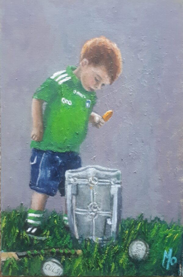 a little boy looking into liam mc carthy cup
