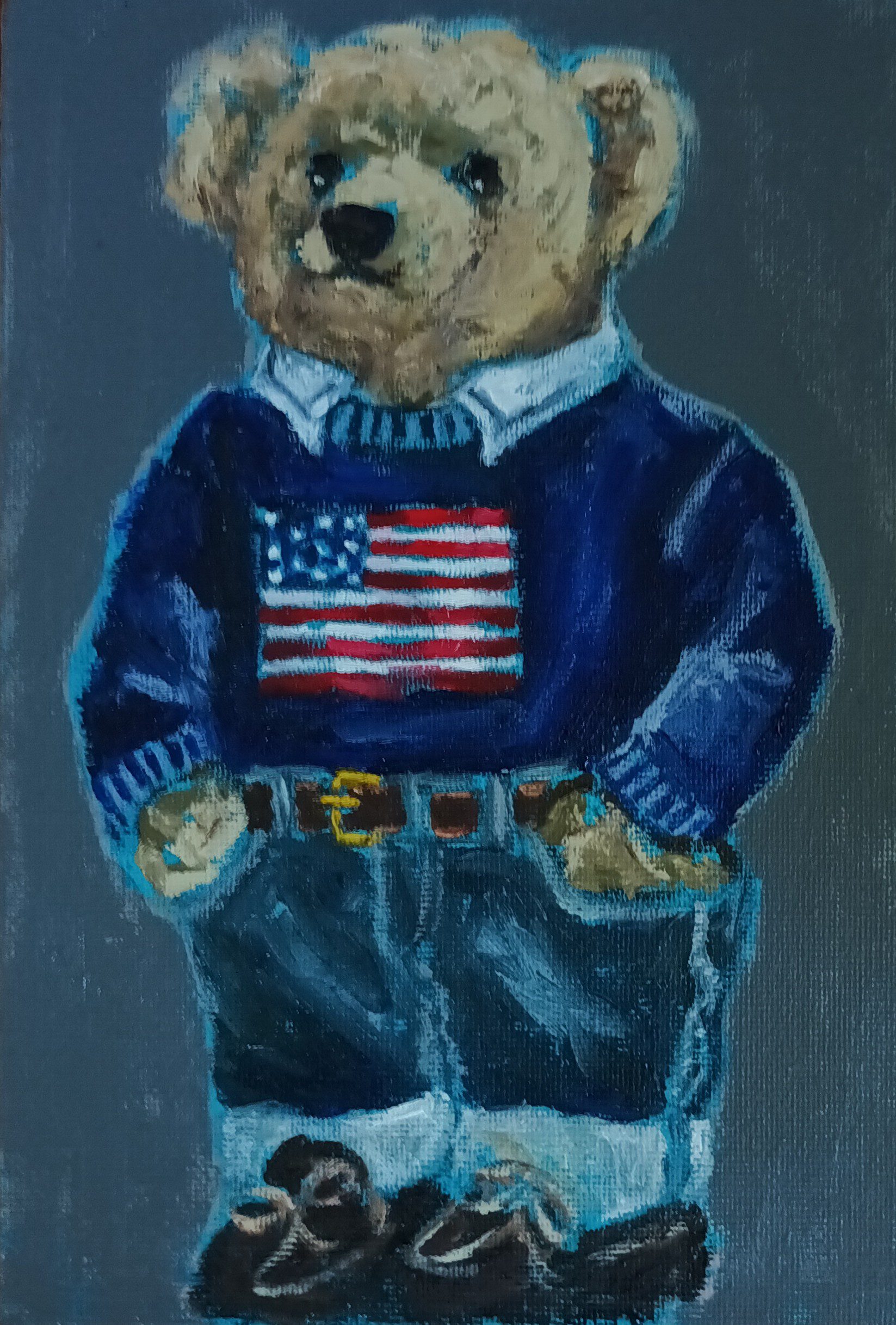 Boy teddy bear dressed up in jeans and sweater
