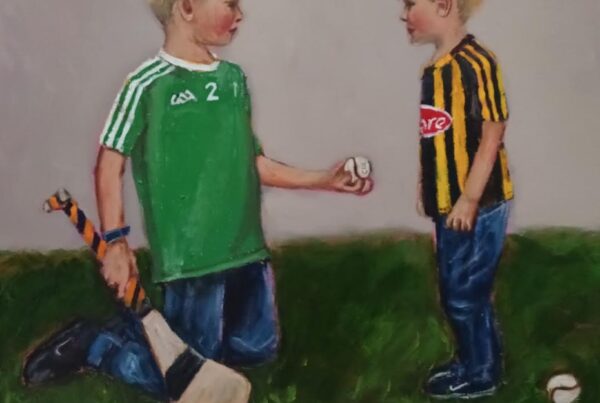 Master Class Hurling To The Core,.Limerick hurler giving a solitary to a younger Kilkenny boy