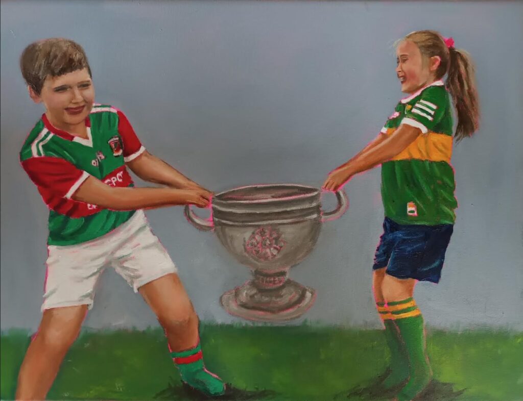 Boy and Girl having a Sam Maguire tug-of-war